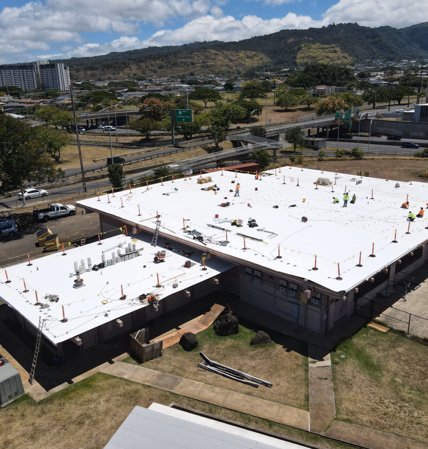 Roofing-work-on-the-tall-building Construction & Roofing Specialist in Oahu